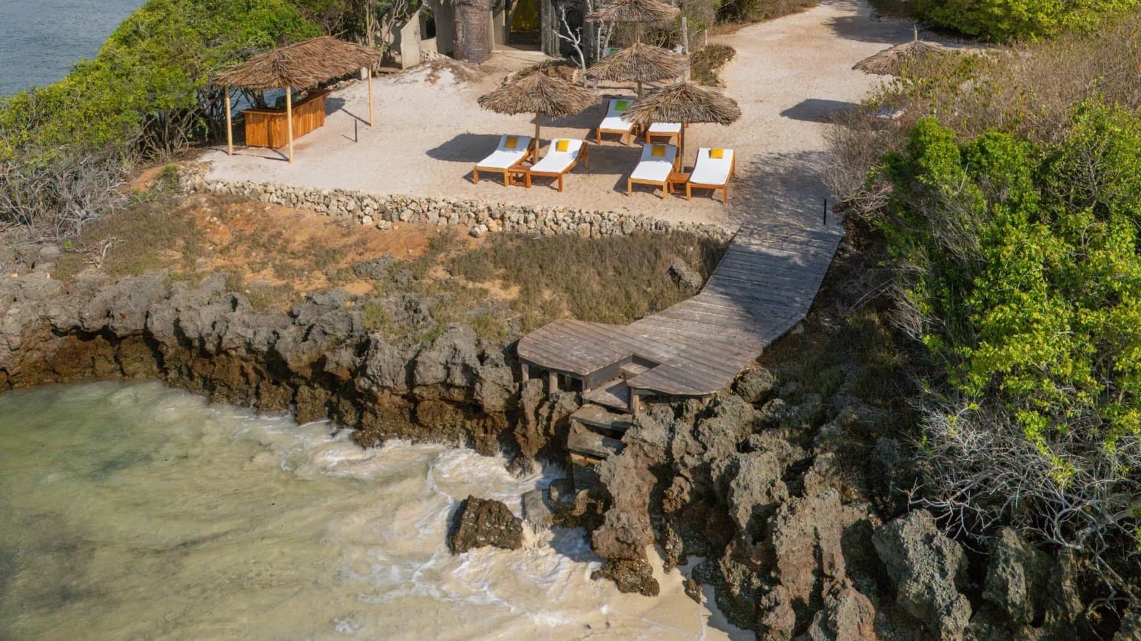 The sun deck on the rocks above the water